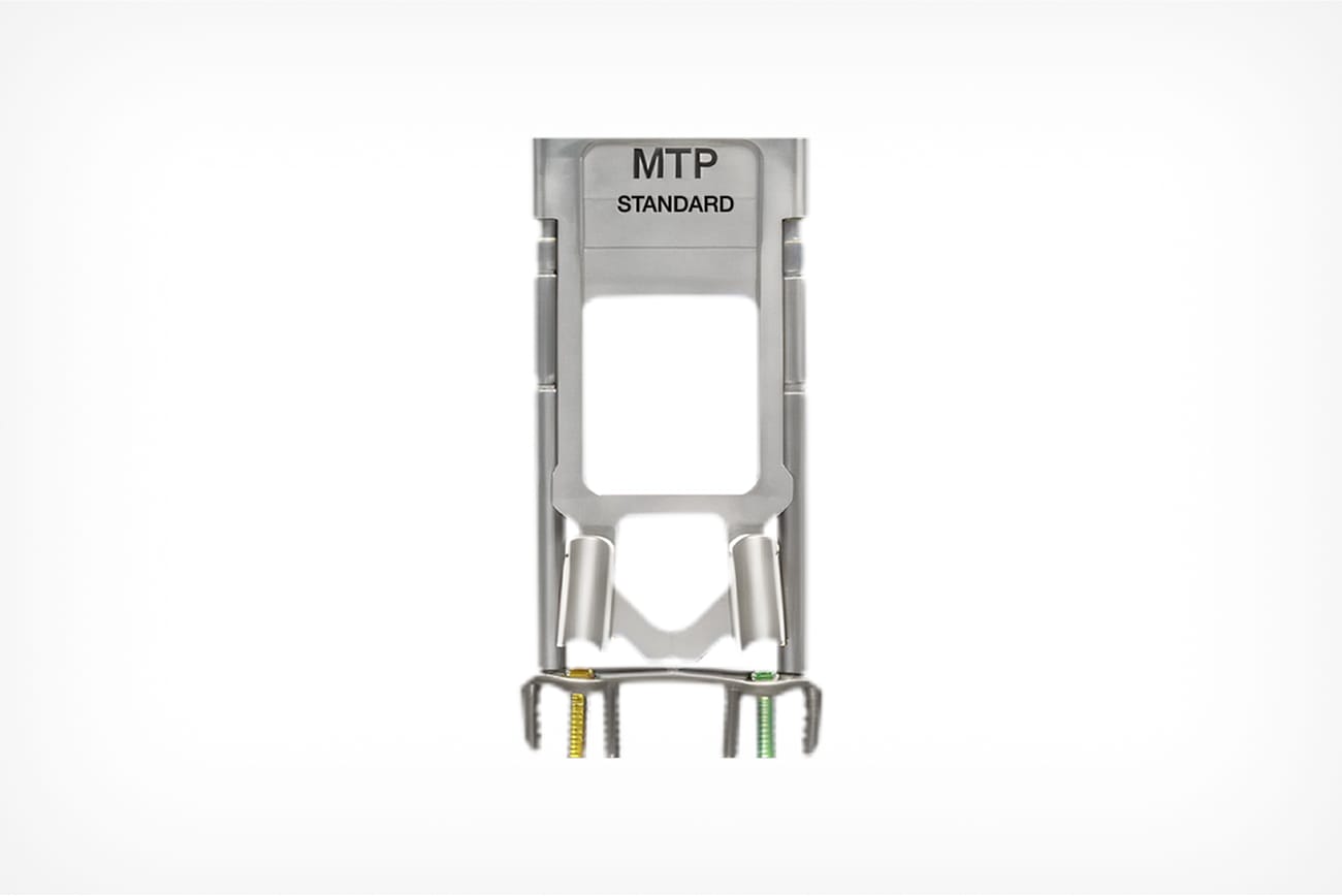Metal component labeled MTP Standard with springs and wires, isolated on a white background.